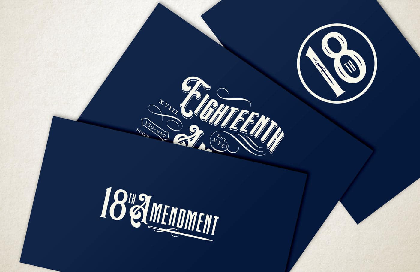 Elegant navy blue branding materials featuring the 18th Amendment logo, showcasing sophisticated typography and a classic design aesthetic inspired by the Prohibition era.
