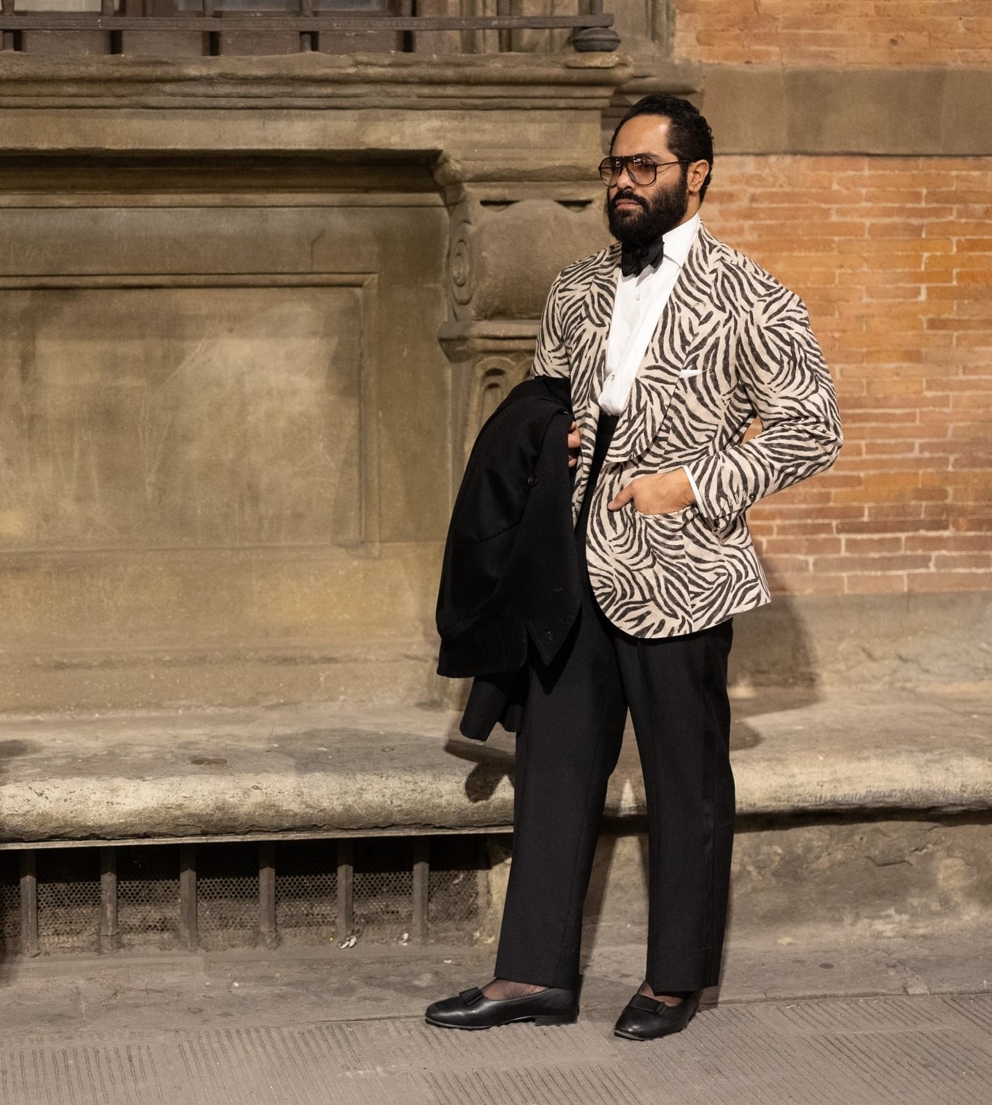 Angel Ramos wearing a zebra print cocktail jacket.